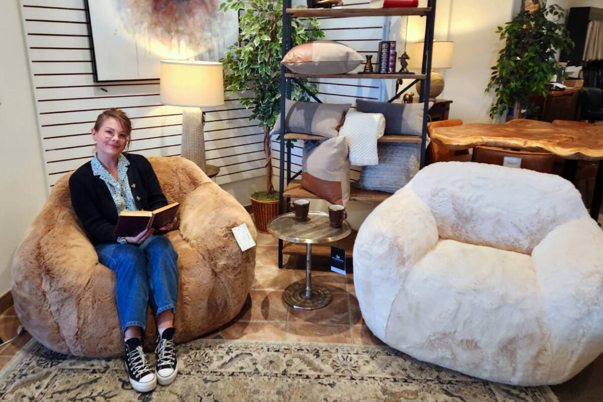 Ashley Lupul, manager at Muse & Merchant trying out the new Tebby Bear Cuddle Chairs.