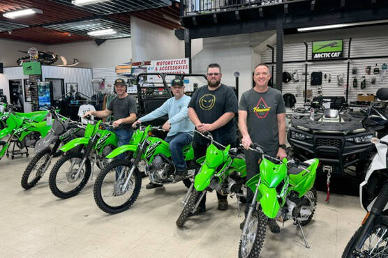 From left to right: Motorcycle mechanic Justin Scott, mechanic Darby Apps, Dan Bruce from parts and sales and owner Brad Dunn.